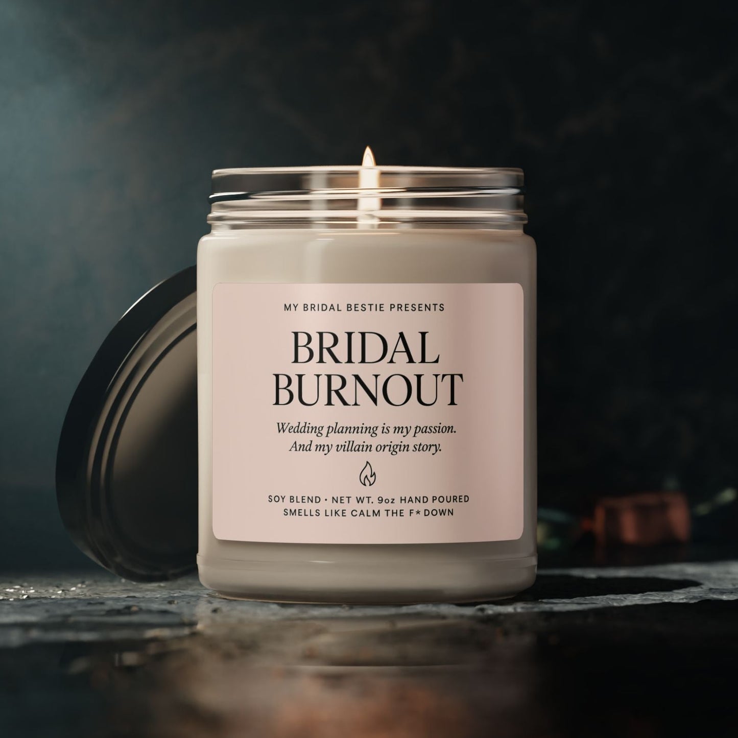 Bridal Burnout Candle in Apple Harvest scent, main context photo on black background, hand-poured soy wax candle with blush label in reusable glass jar.