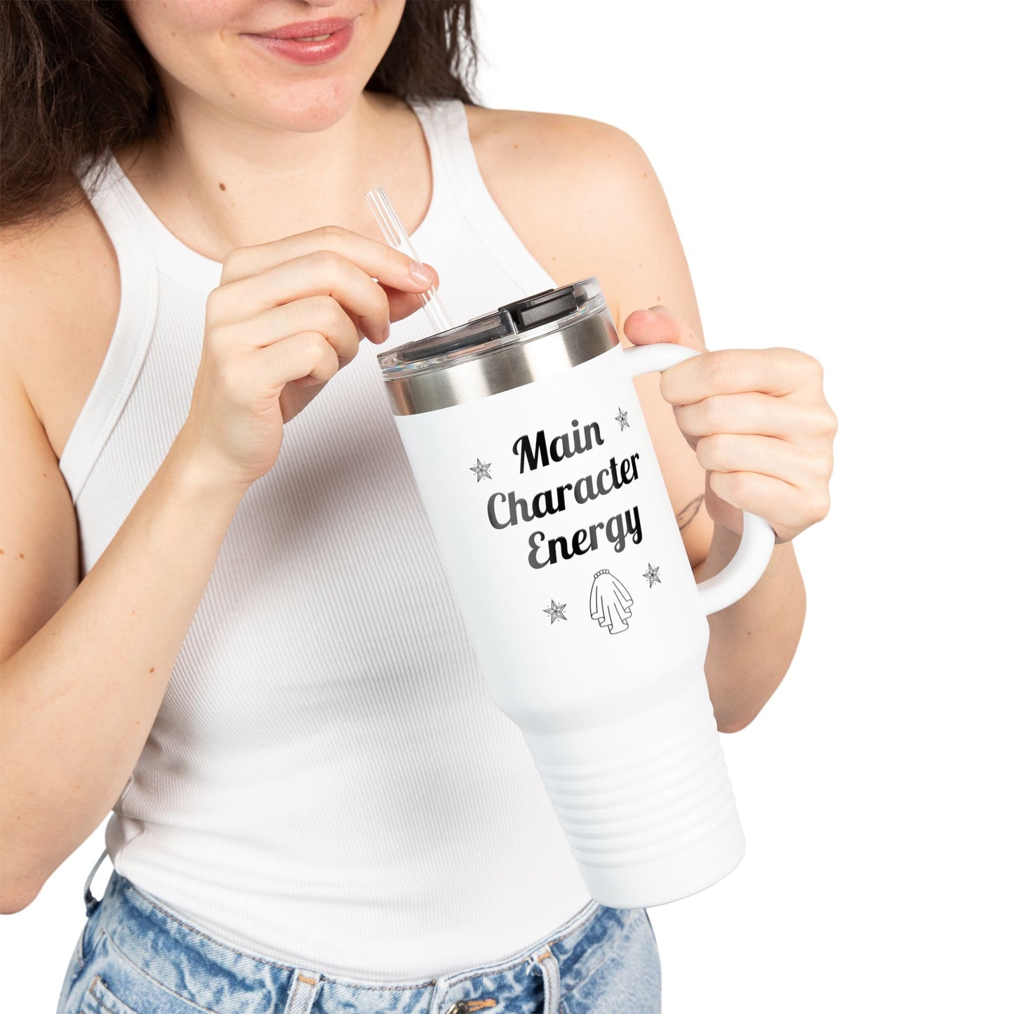 Smiling bride holding white Main Character Energy tumbler, 40oz bridal mug with bold black text and straw, perfect for wedding planning